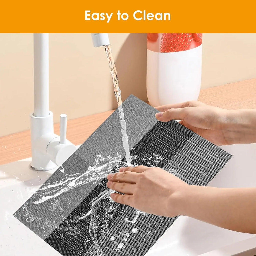 Hand rinsing a woven vinyl placemat under running water for easy cleaning