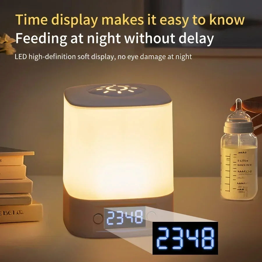 digital clock night light illuminated on a bedroom table at night with visible time display