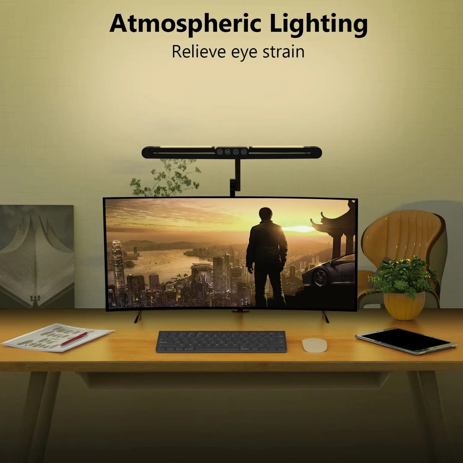 LED clamp desk lamp providing ambient lighting on a home office desk with a large monitor at night