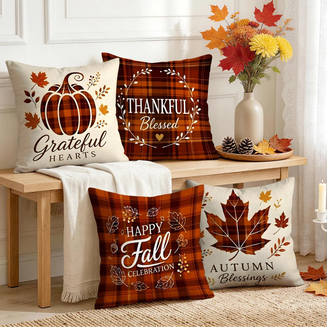 Set of four autumn-themed plaid throw pillow covers on a bench, featuring pumpkin and maple leaf designs with fall sayings.