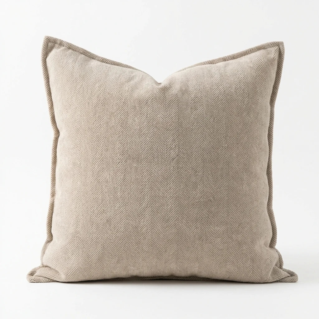 Square woven herringbone pillow cover in beige on white background