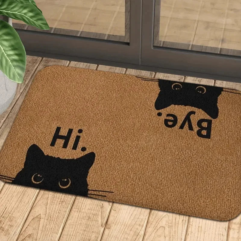 Cat face entry mat placed inside a sunlit glass door