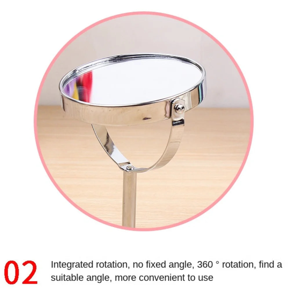 Close-up of a tabletop makeup mirror with a rotating oval design