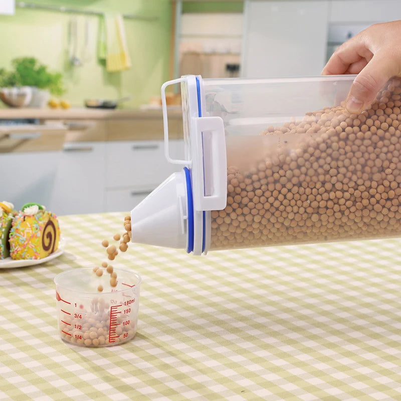 Airtight container pouring dry food into a measuring cup on a kitchen table with a checked tablecloth