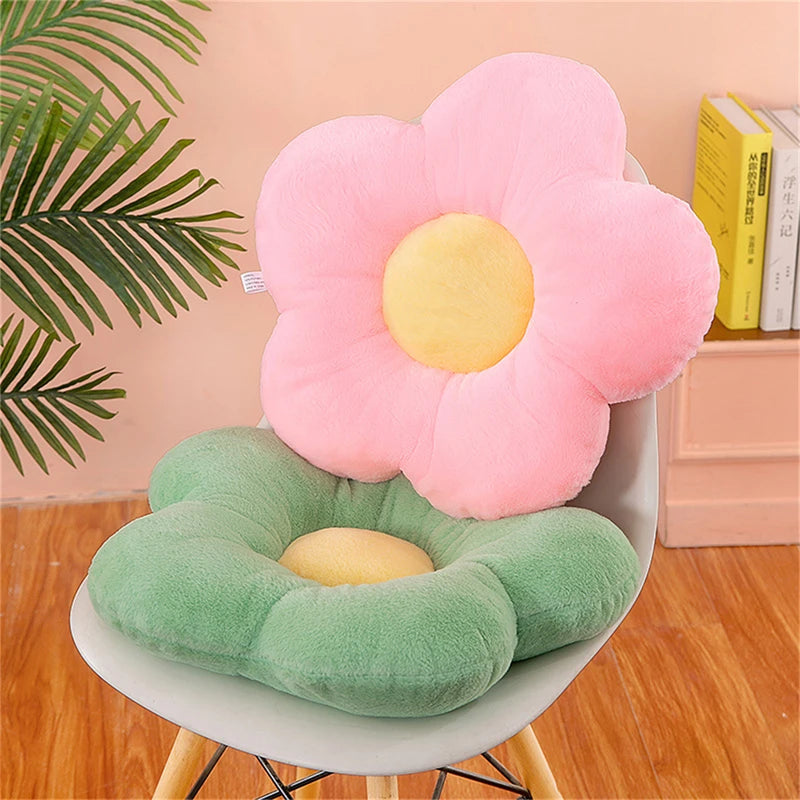 Pink and green five-petal plush flower cushions on a chair in a cozy bedroom