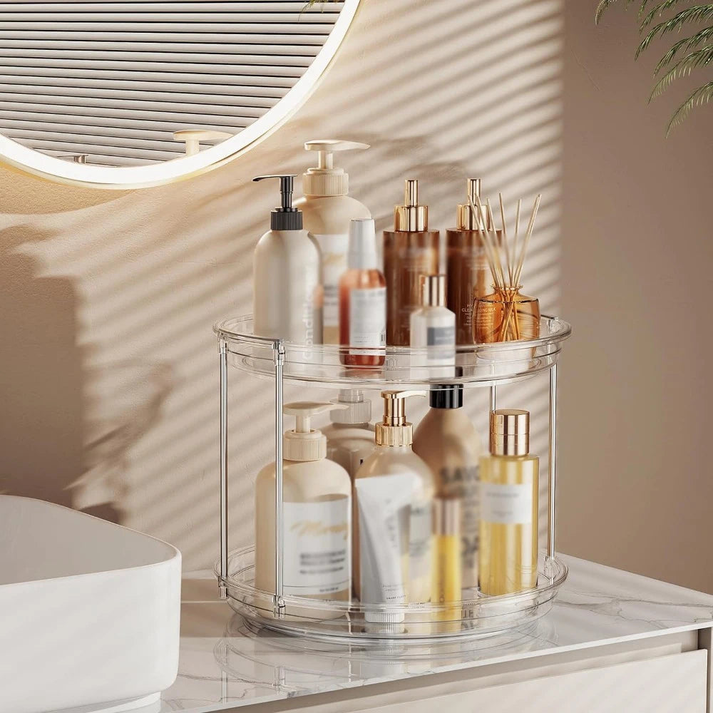 2-tier clear organizer displaying bathroom bottles and toiletries on a vanity