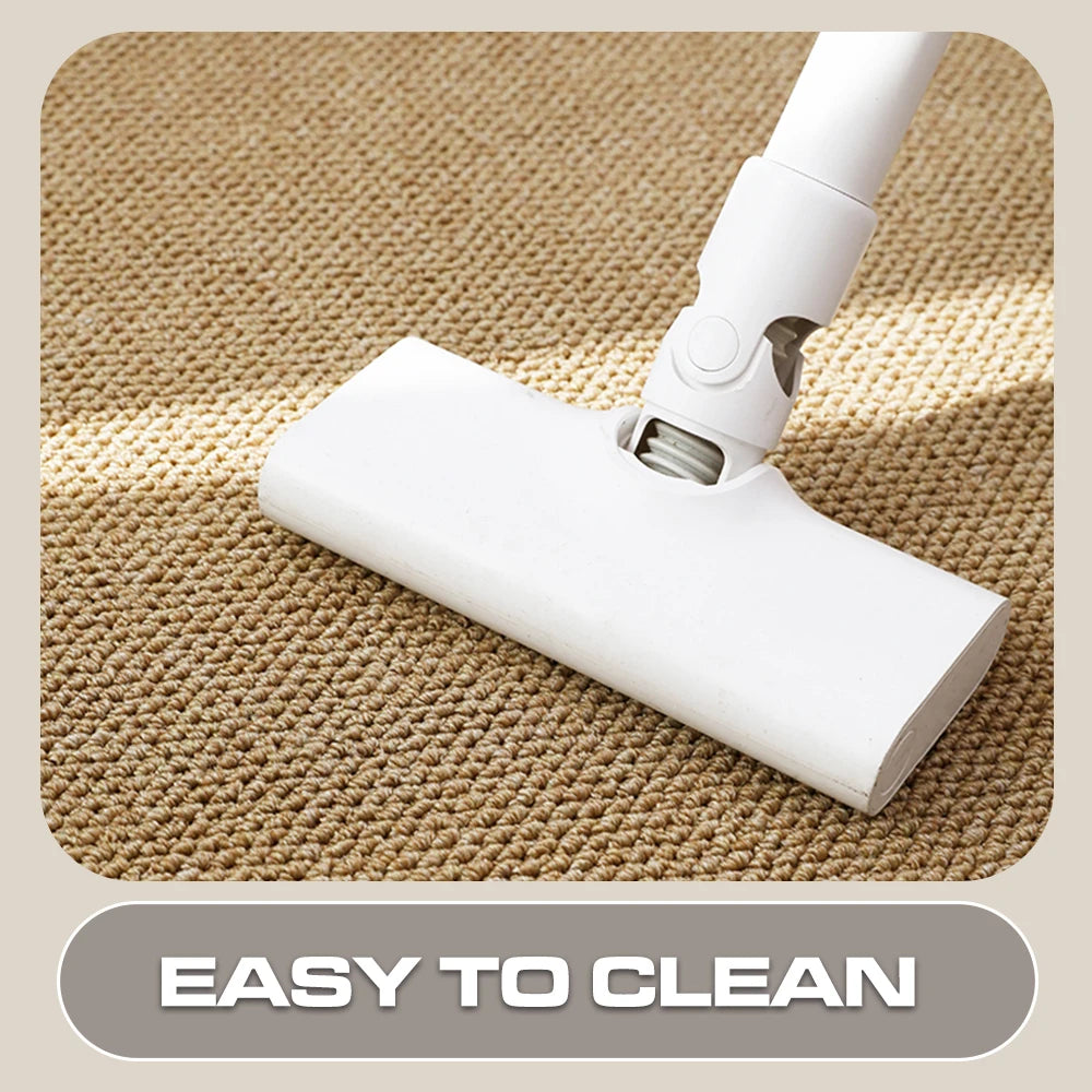 vacuum cleaner head gliding over a looped beige doormat, highlighting easy cleaning