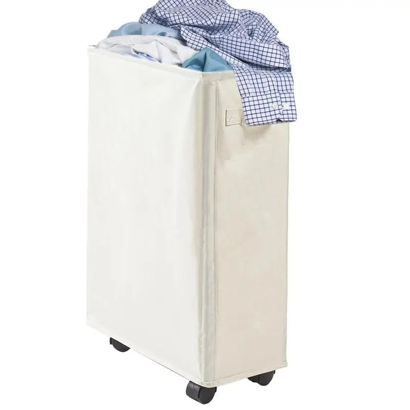 Slim beige rolling laundry hamper filled with laundry, side handle and wheels visible
