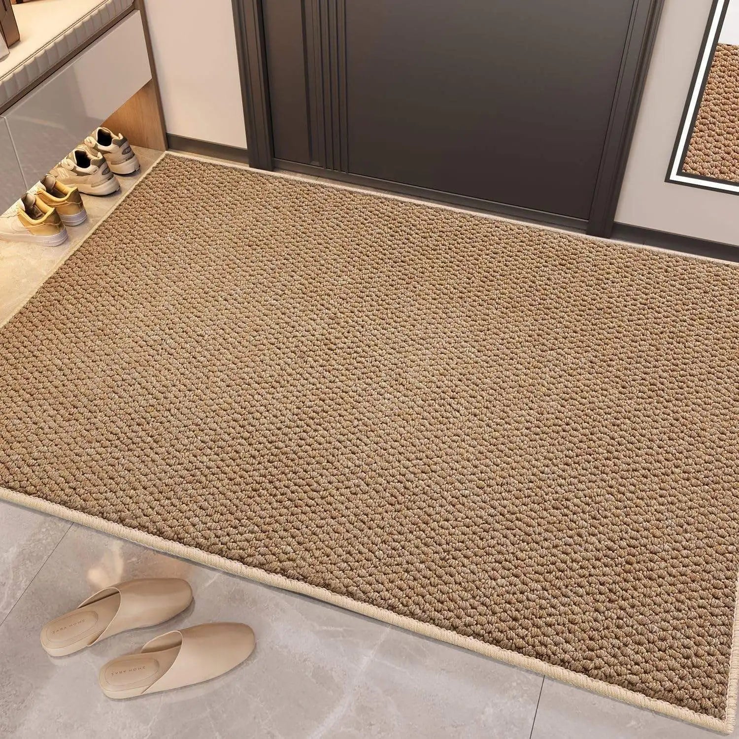 Textured tan anti-slip entryway mat placed at a front door with slippers nearby