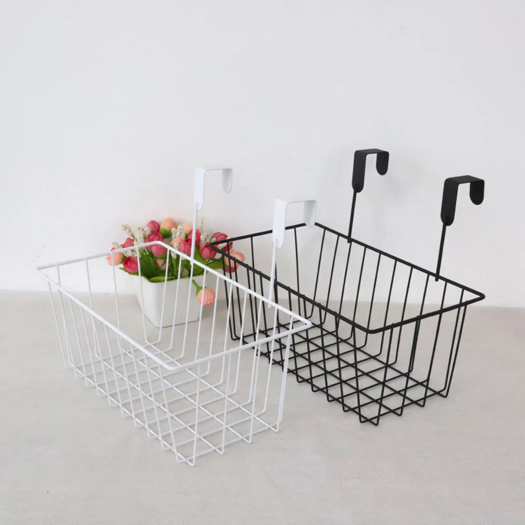 Black and white wire basket organizers with a small flower arrangement for scale