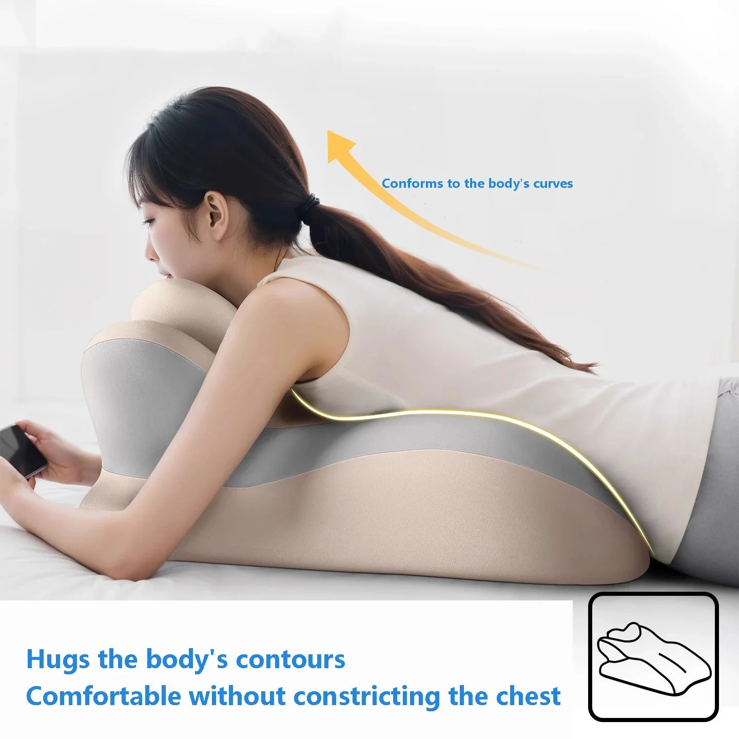 Person lying on beige and gray ergonomic wedge pillow, showing how it conforms to the body's curves