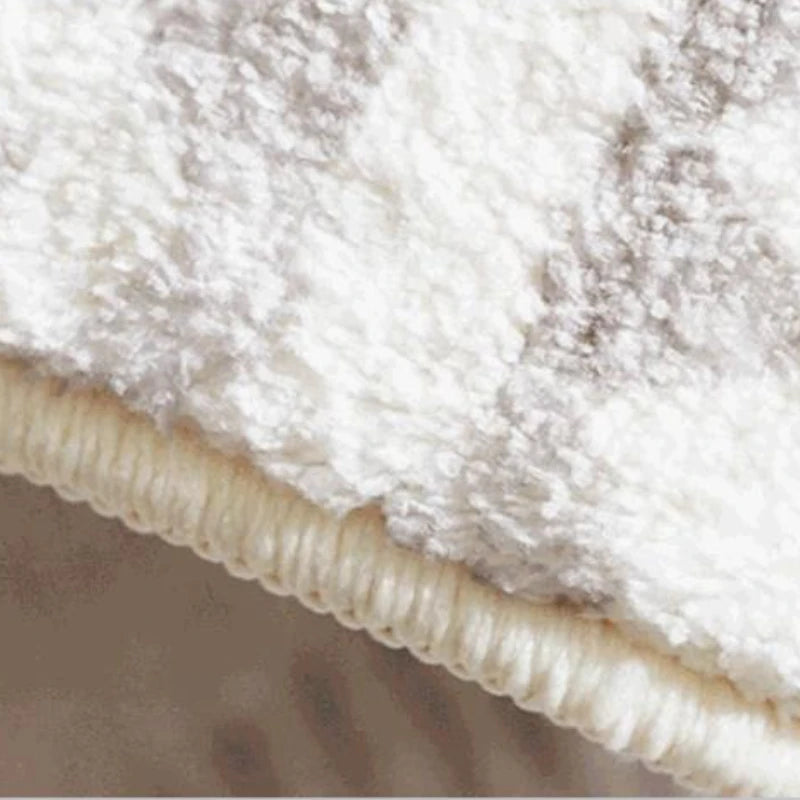 Detail of the edge stitching on the plush abstract rug