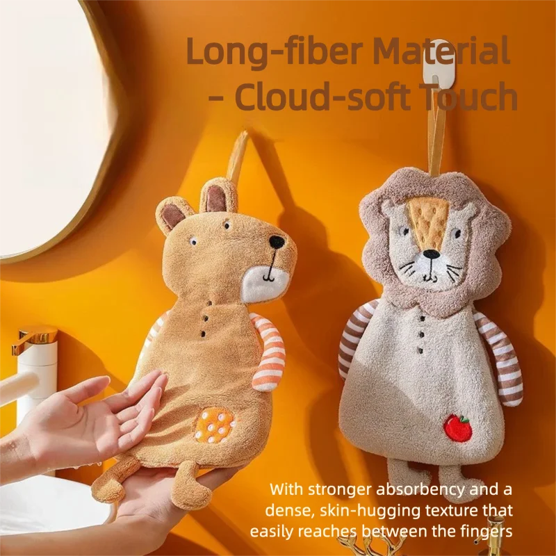 Person reaching for a bear-shaped hanging hand towel next to a lion-shaped towel by a bathroom mirror