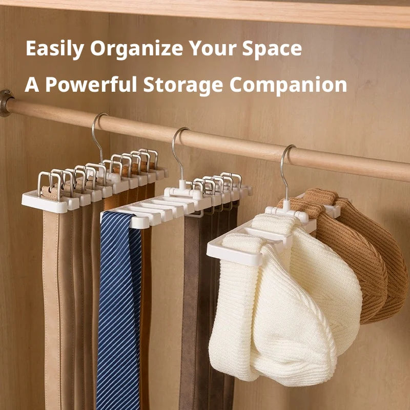 White and black rotating accessory hangers in a closet holding belts, ties, and hats; text overlay present
