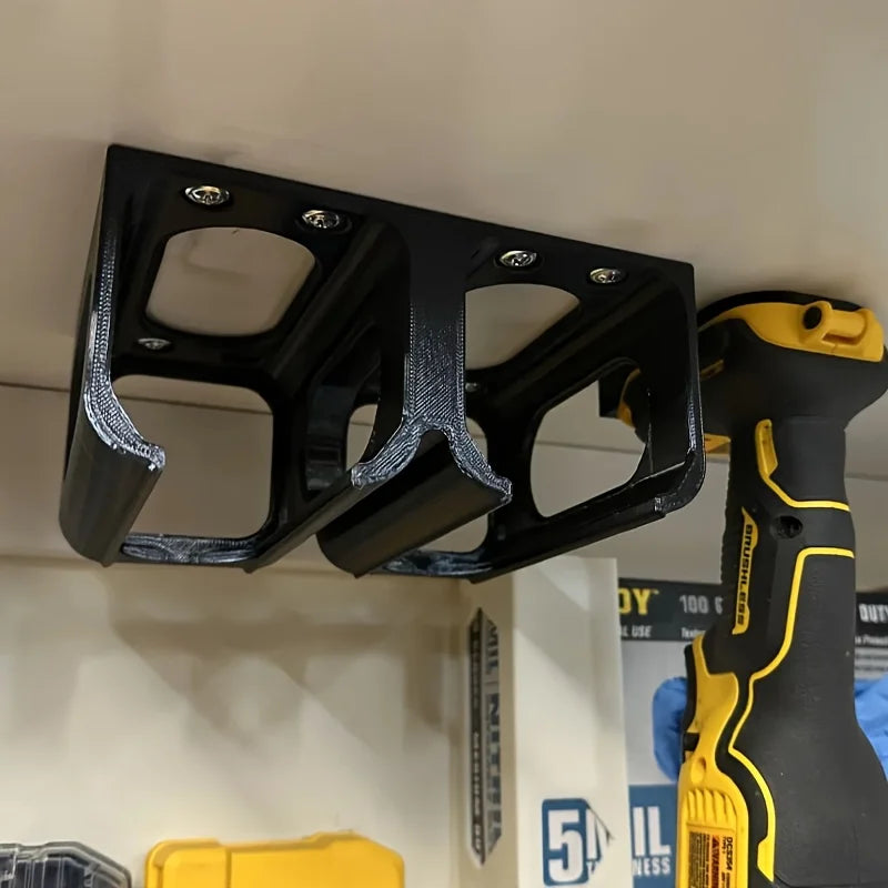Close-up of power tool holder mounted under a shelf in a workshop setting