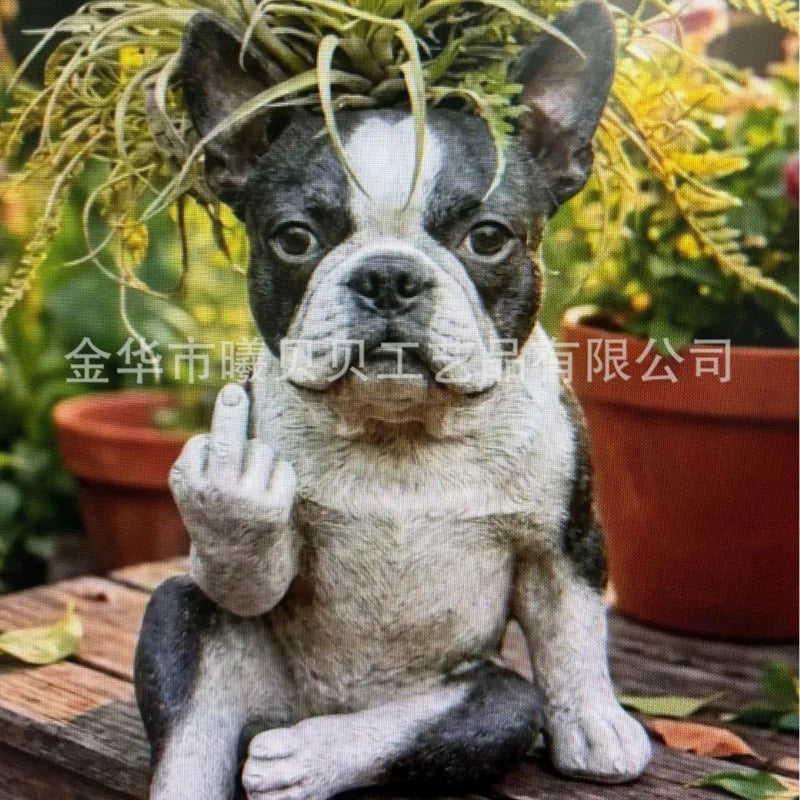 Black and white French bulldog resin planter with air plant, outdoor garden background