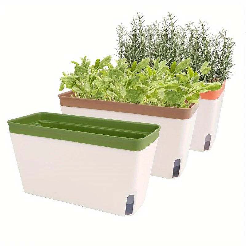 Three rectangular self-watering planters with fresh herbs and flowers, showing water level indicators