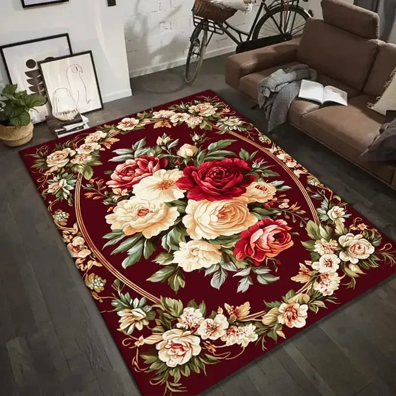 Vintage floral area rug with red, cream, and pink flowers in a living room setting