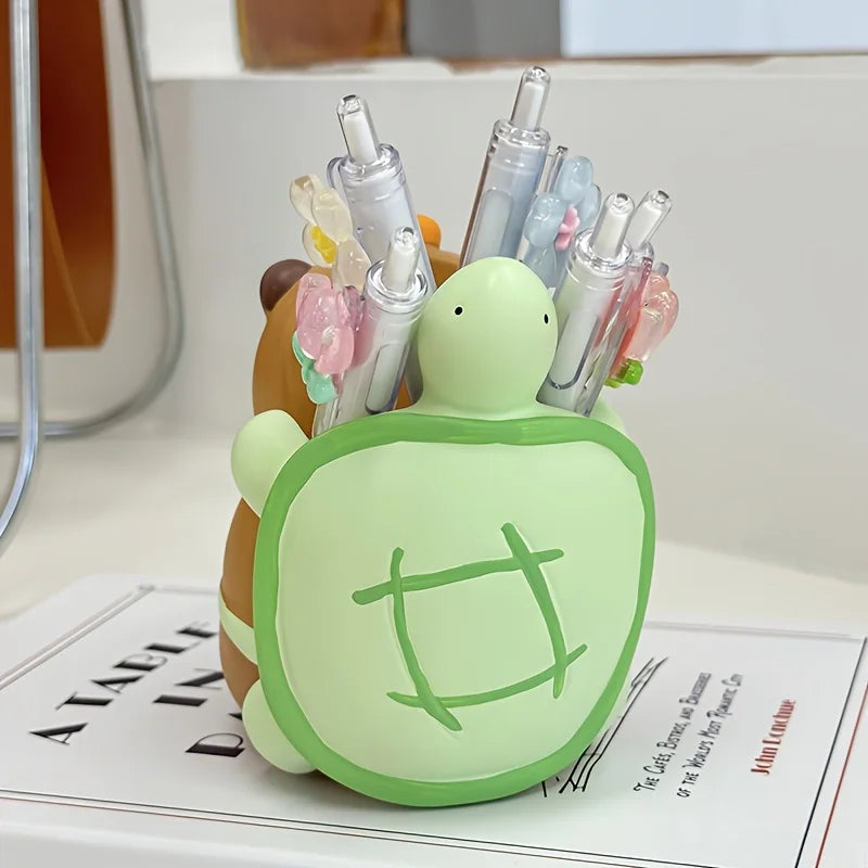 Back view of capybara turtle pen holder showing turtle shell and pens