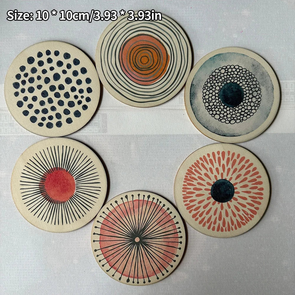 Close-up of six round patterned drink coasters, showing size and abstract designs