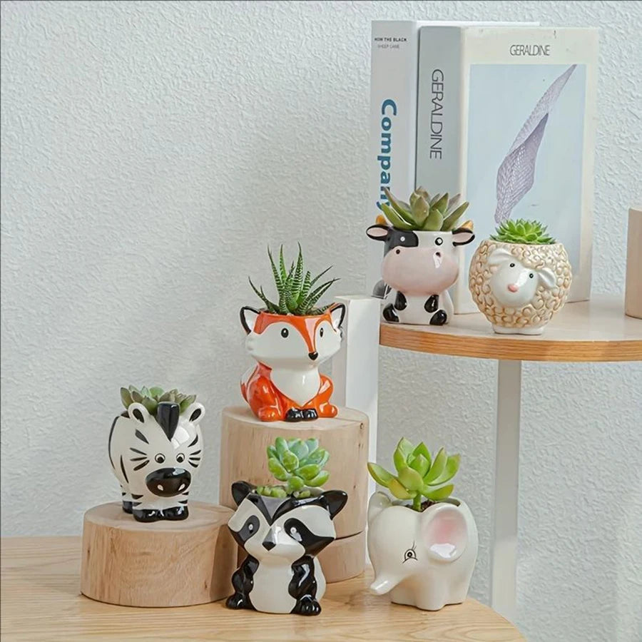 Grouped animal ceramic succulent planters arranged on shelves and wooden stands