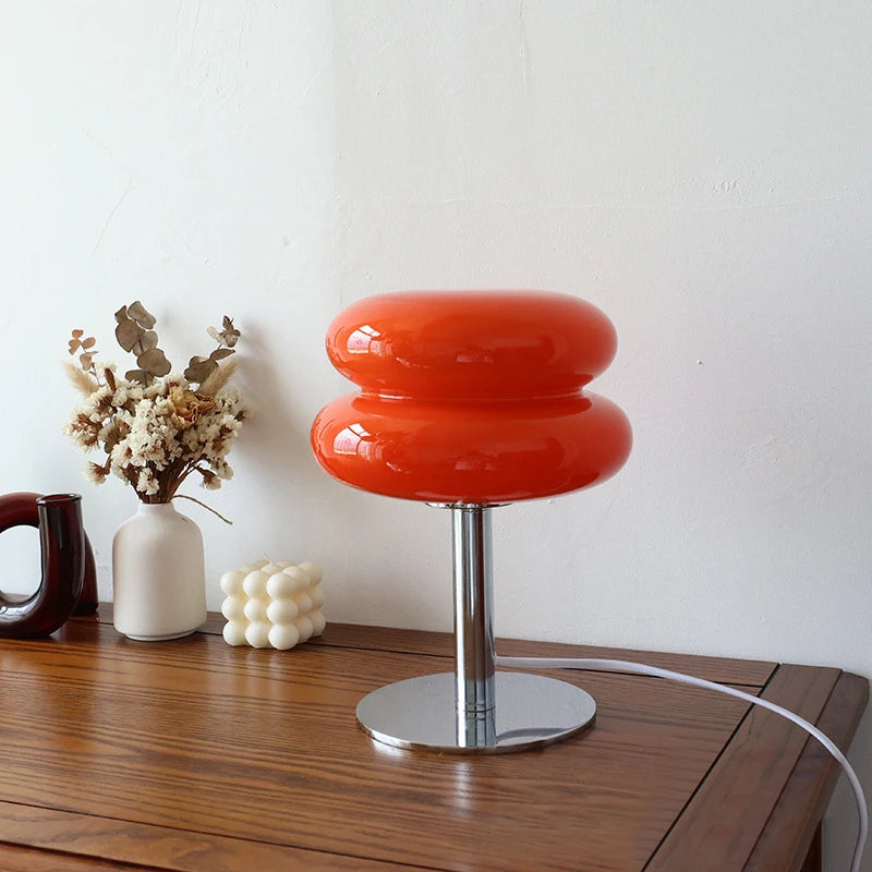 Macaron table lamp in orange lit by daylight in a cozy room