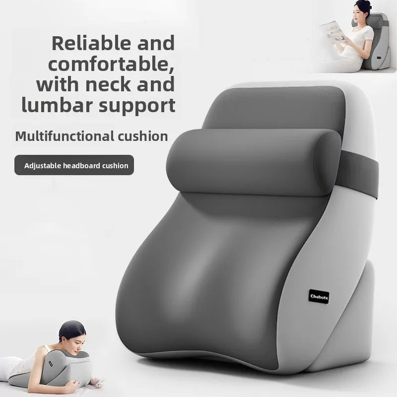 Ergonomic wedge reading pillow with neck and lumbar support, shown in gray with a woman reading while sitting in bed