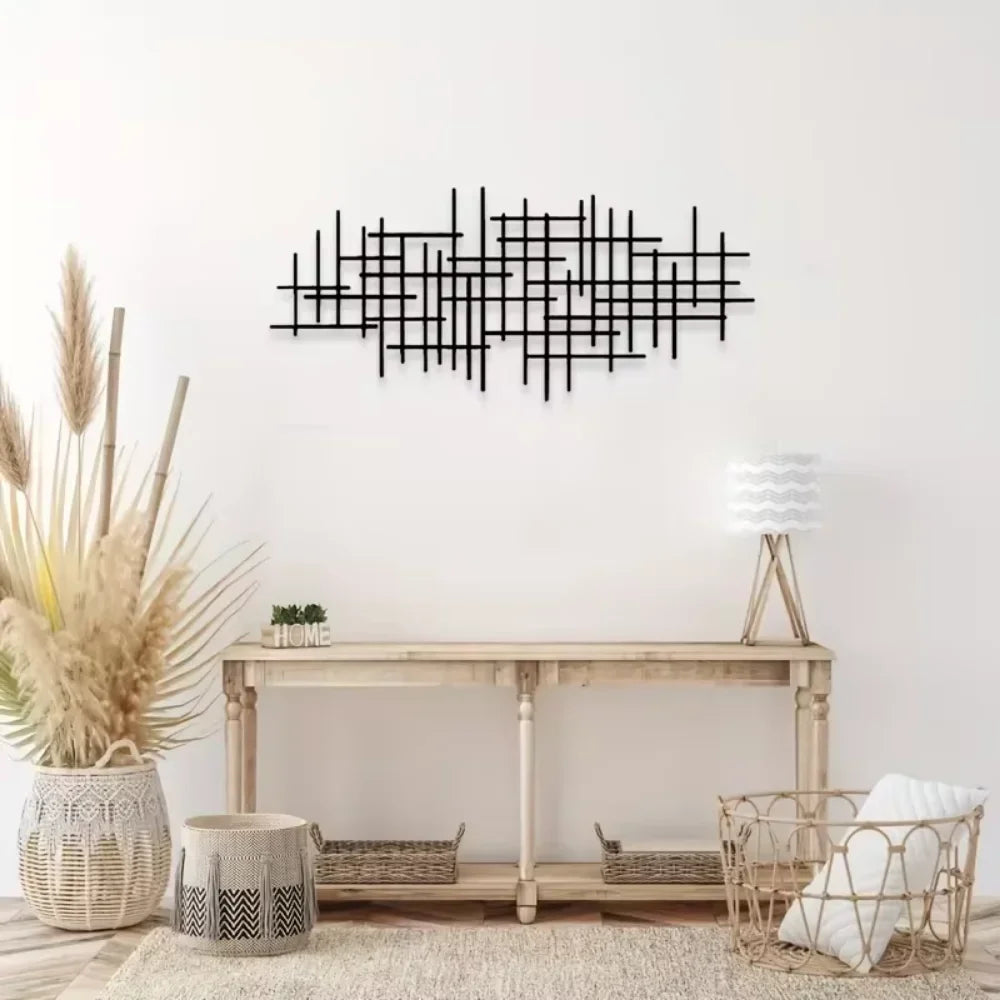Geometric grid wall decor panel styled above a console table in a bright, neutral room