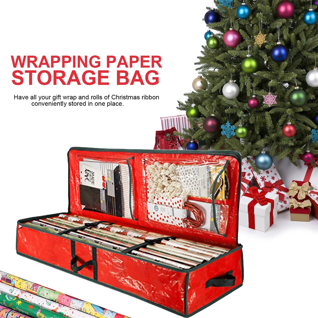 Red wrapping paper storage bag under a decorated Christmas tree with clear internal pockets and rolls of gift wrap.