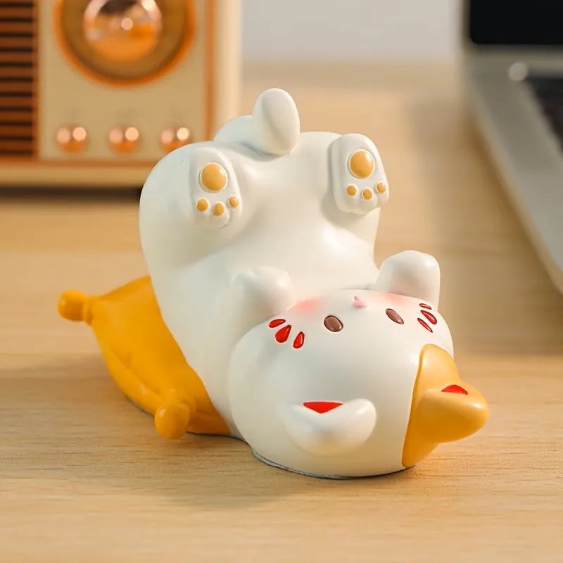 cute white cat-shaped desk stand lying on its back with orange and red details