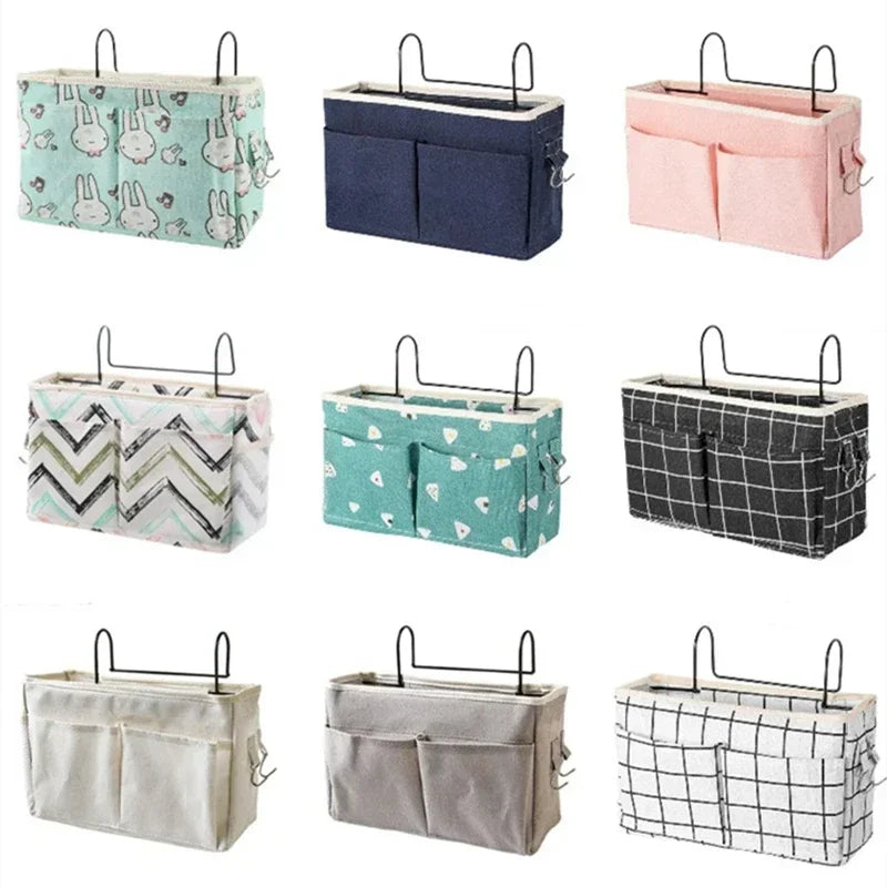 Array of hanging fabric bedside organizer caddies in various colors and prints, each with pockets and over-rail hooks