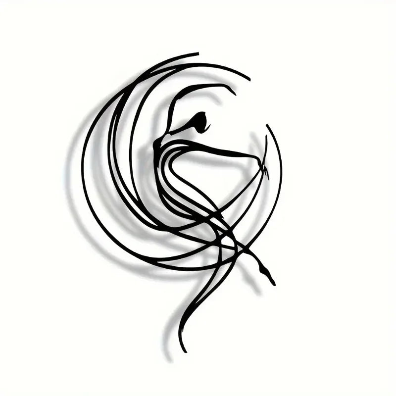 Close-up of minimalist metal dancer wall art on a plain white background