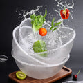 Clear round acrylic serving bowl with fresh vegetables and water splash for salad or fruit