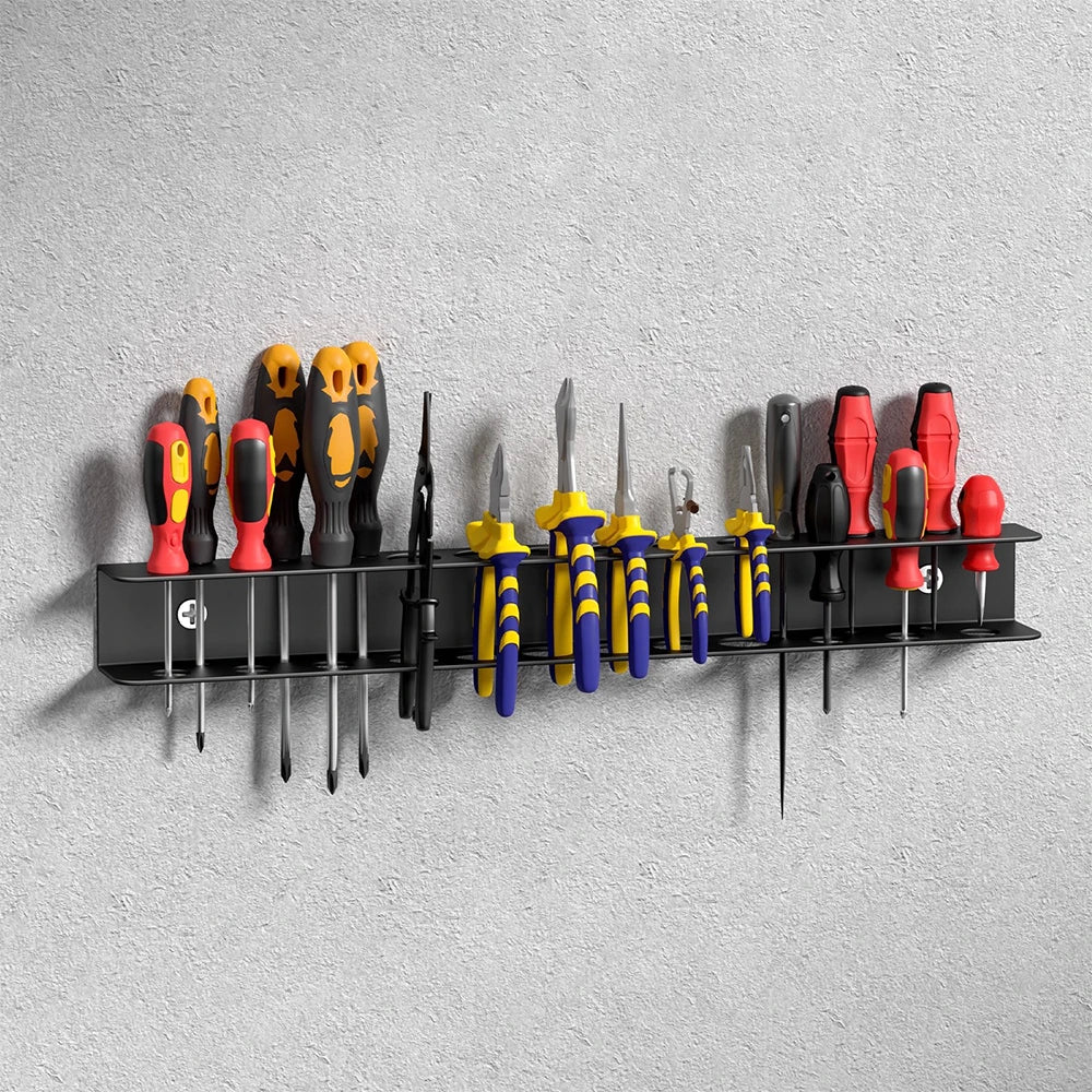 Wall-mounted tool rack in a garage with an assortment of screwdrivers and pliers neatly organized on the rack.