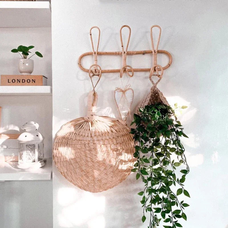 Three-hook rattan wall hook used for hanging boho accessories, baskets, and plants