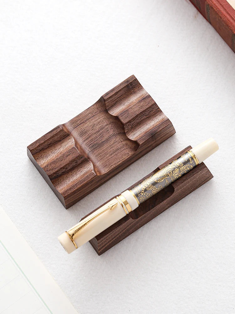 Walnut wood pen holder stand for one and two pens on a desk