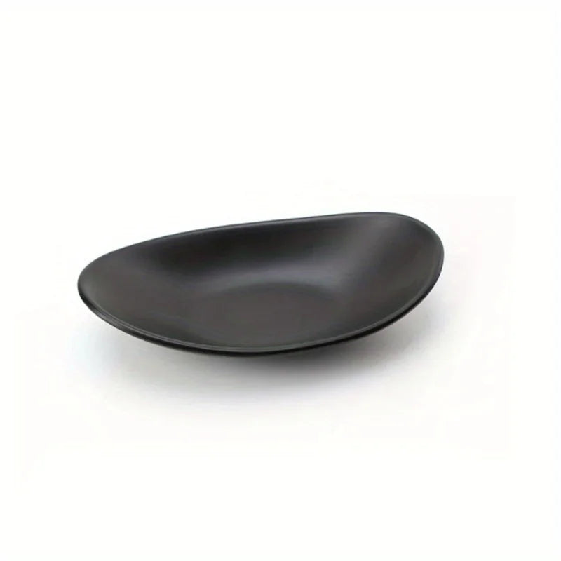 single matte black oval ceramic tray displayed on a white background