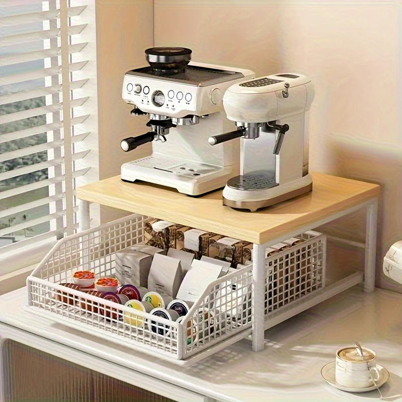 White coffee station organizer on counter with mesh basket for coffee pods and a wooden top holding espresso machines