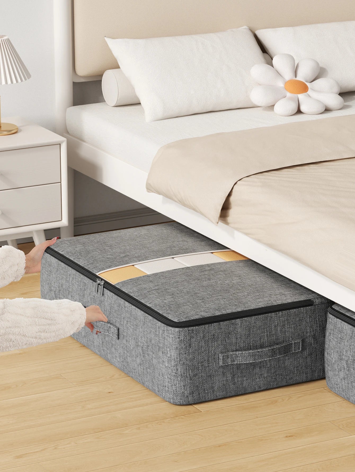 Underbed storage bag fully zipped and tucked neatly under a bed