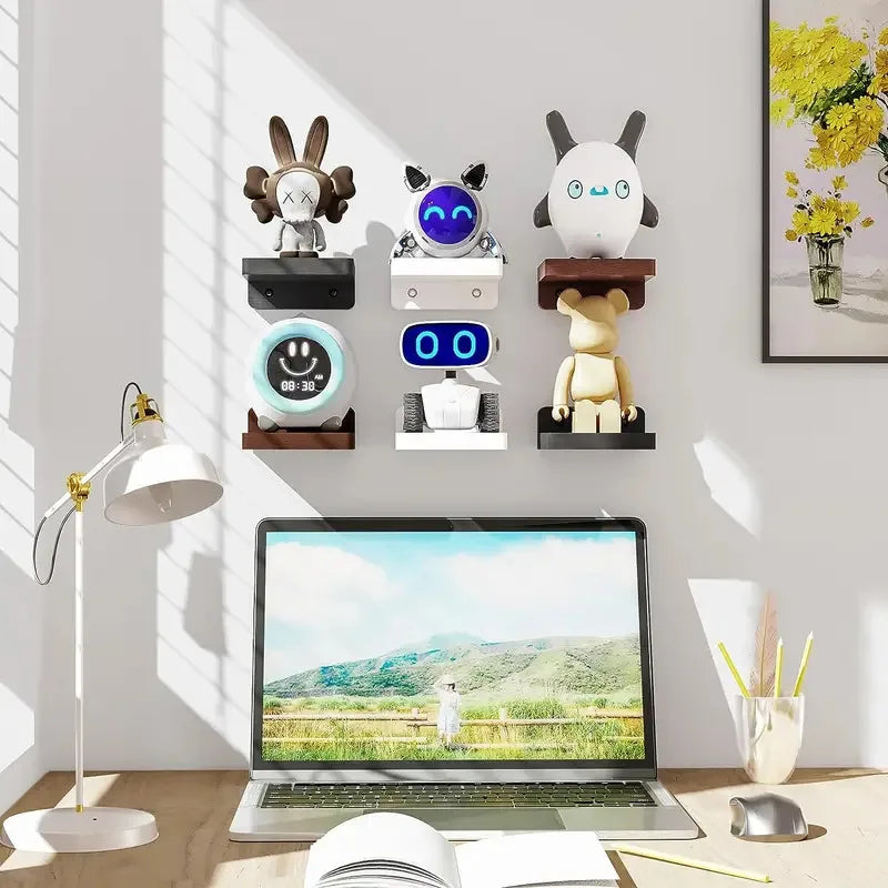 Set of small floating shelves in various finishes displaying collectibles above a desk.