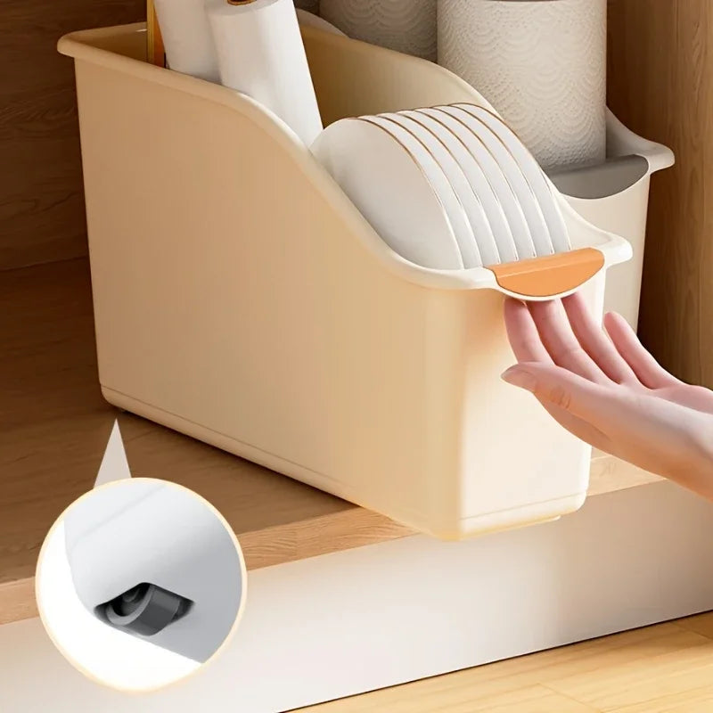 Close-up showing the orange accented handle on the curved storage bin for easy access