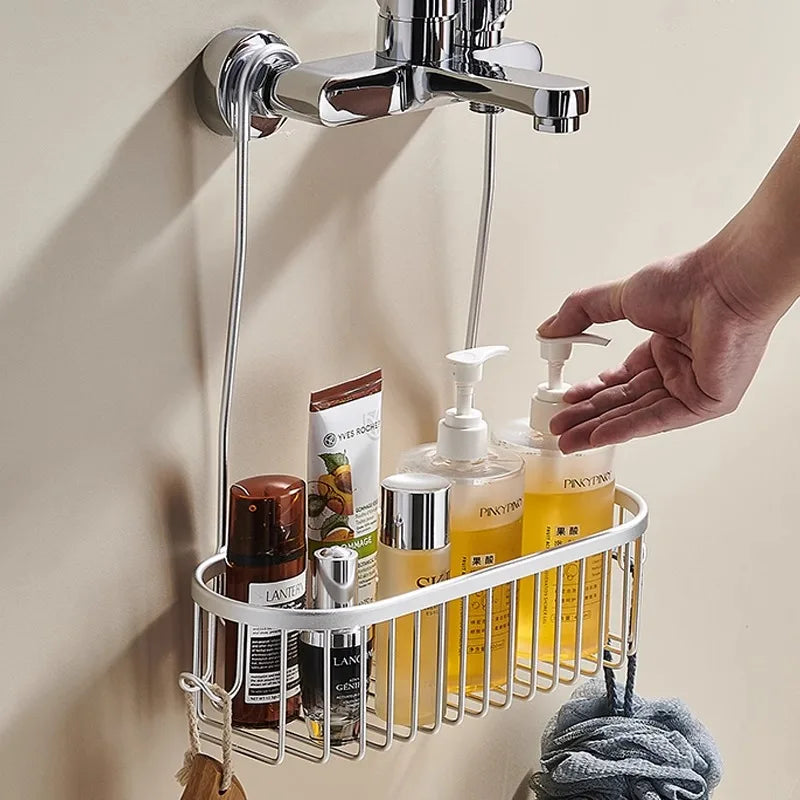 Hanging aluminum shower caddy holding toiletries and soap dispensers