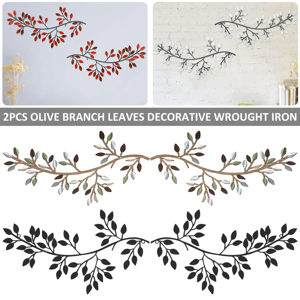 Set of two olive branch metal wall art sculptures in red, white, and black colorways displayed on living room walls