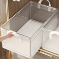 Clear PVC storage basket with steel frame and fabric handle on a shelf