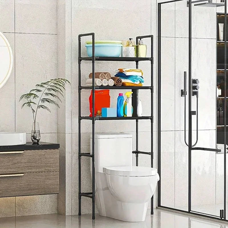 Over-toilet storage rack holding towels and bottles in a bright bathroom