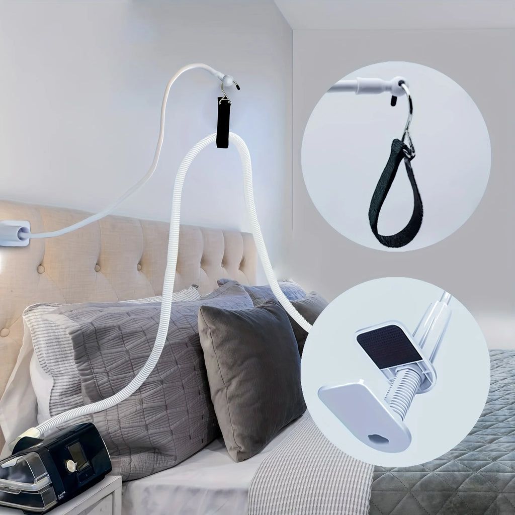 CPAP hose holder attached to a tufted headboard, with close-ups of the hook strap and clamp