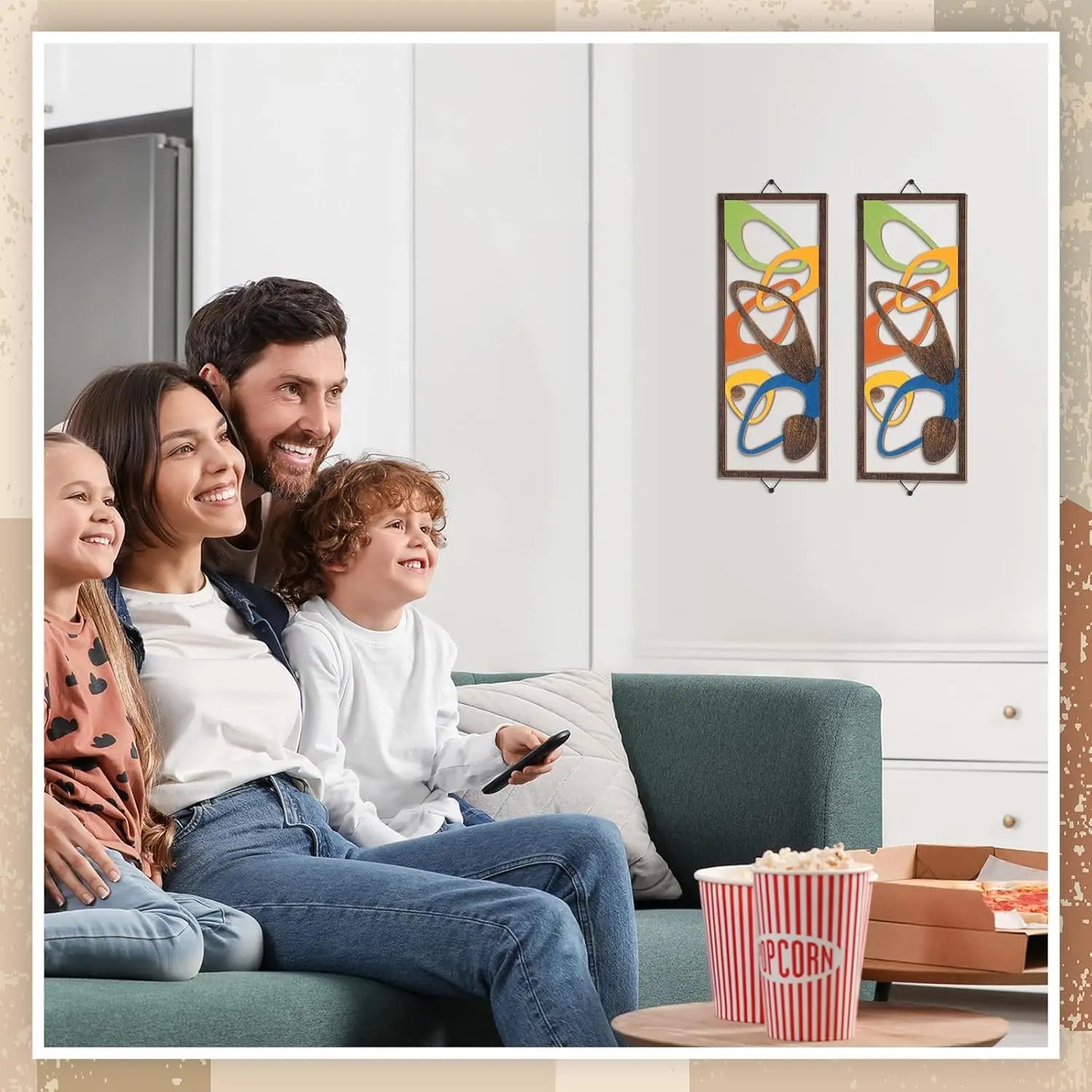 Two abstract wooden wall panels with geometric design displayed above a sofa in a family living room