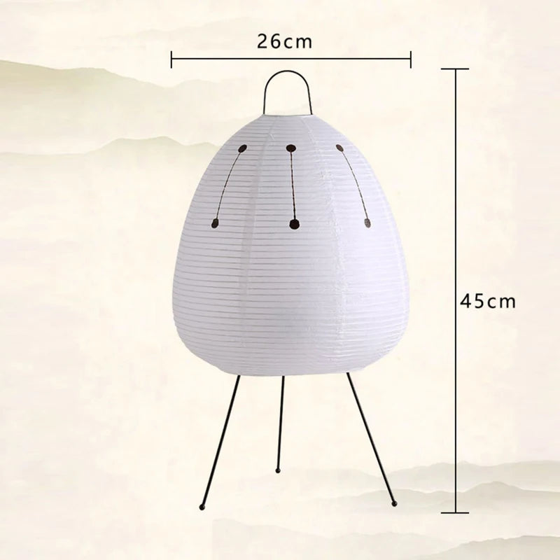 Rice paper table lamp with a white shade on metal legs, shown with dimensions 26cm wide and 45cm high