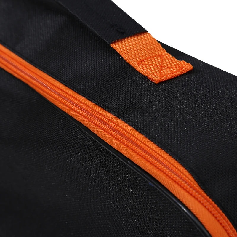 close-up of orange handle on black polyester organizer bag