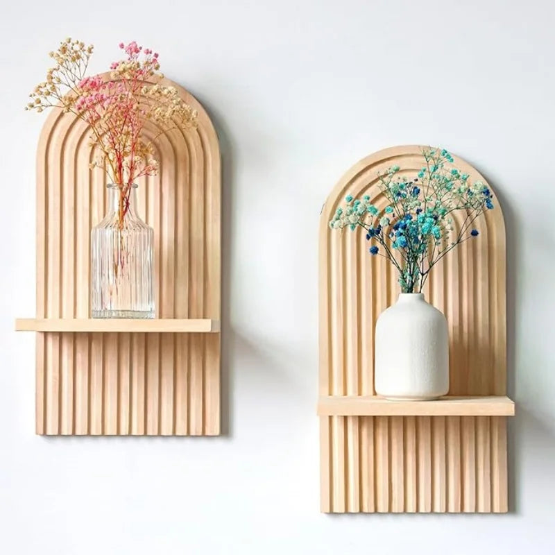 Pair of arched wooden boho wall shelves with vases and dried flowers